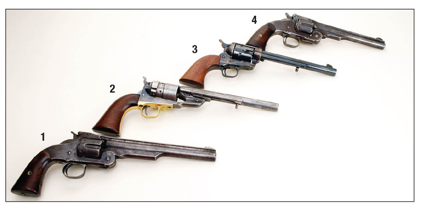 Four handguns that were popular in the 1870s include the (1) Smith & Wesson Model No. 3 .44 American, (2) Colt Model 1860 Conversion .44 Colt, (3) Colt SAA .45 and the (4) Smith & Wesson No. 3 Schofield .45 S&W.